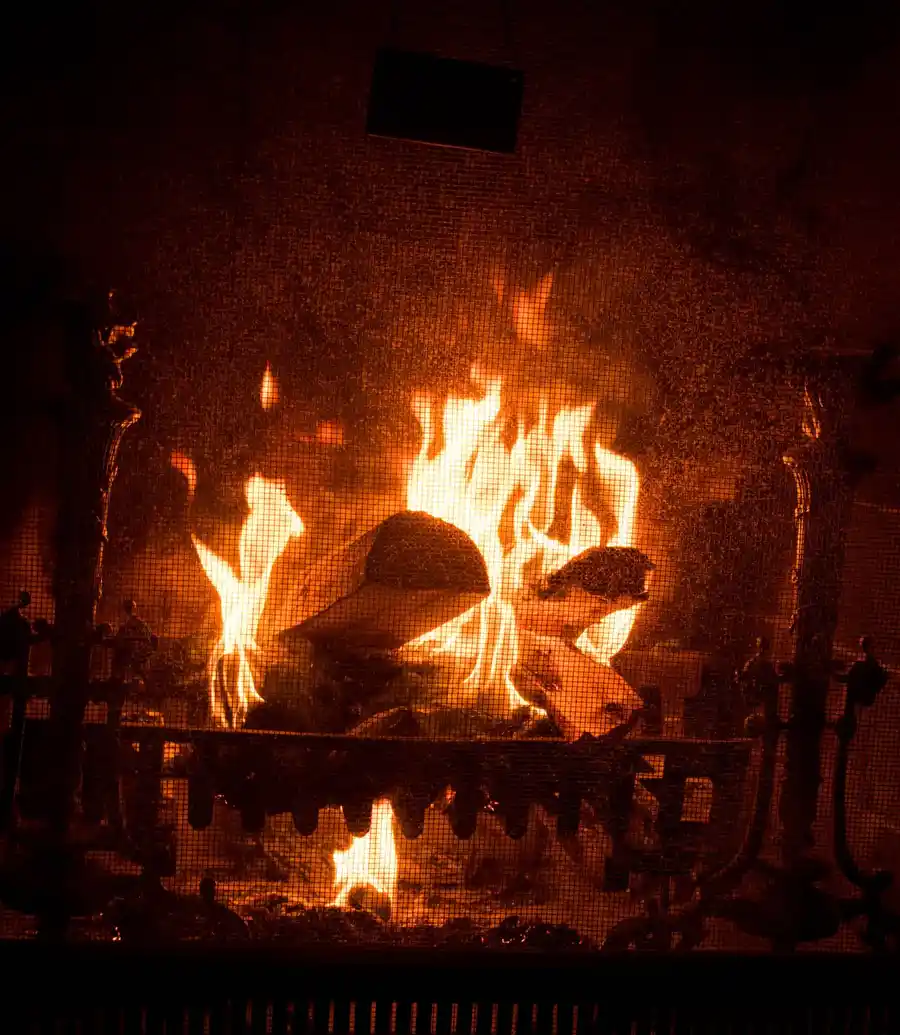 Fireplace hearth glowing warm at night