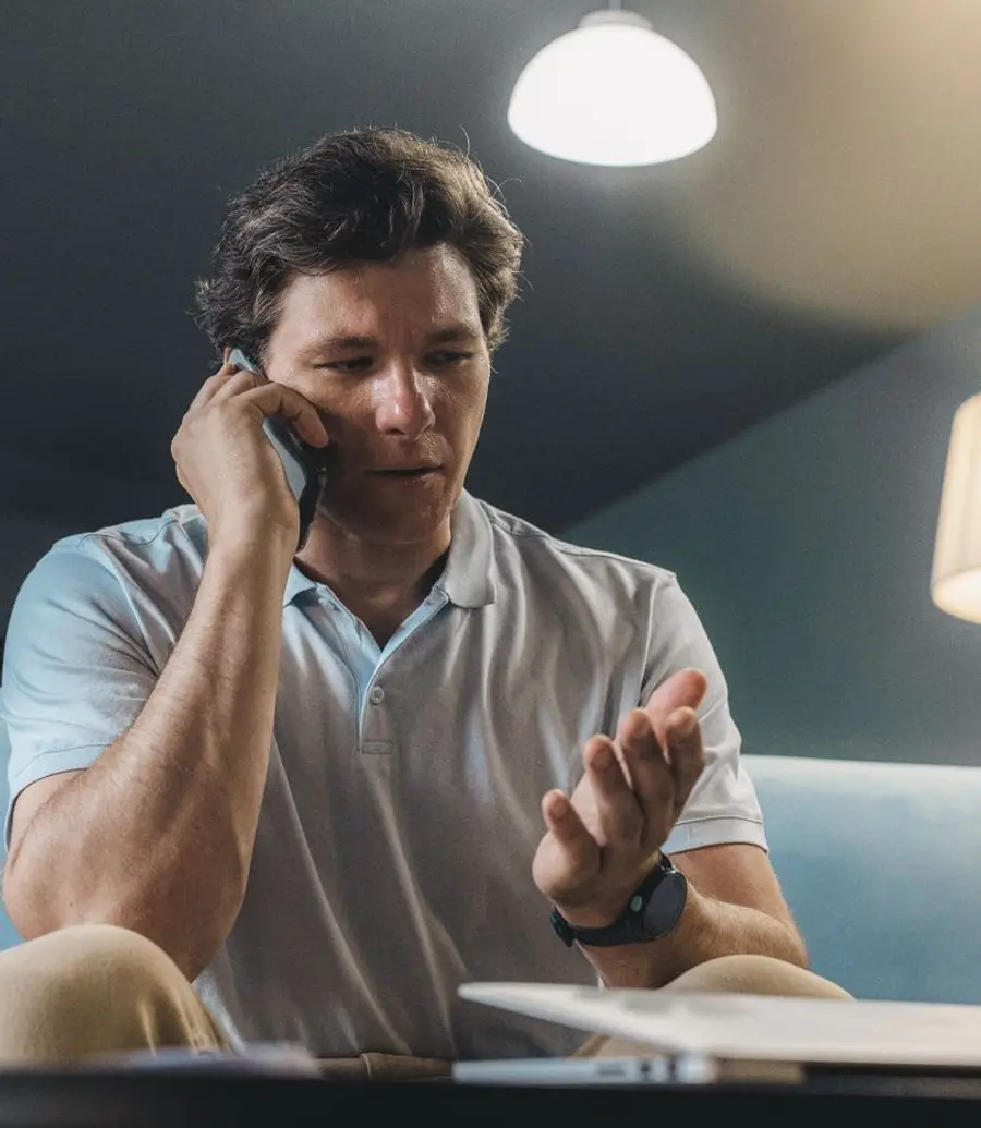 Resident on the phone at home in the evening