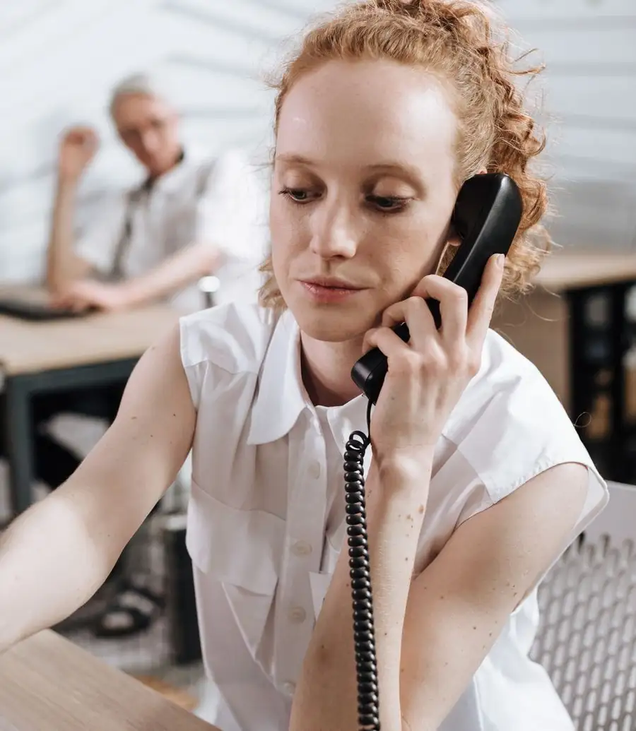 Legal professional taking down details during a phone call