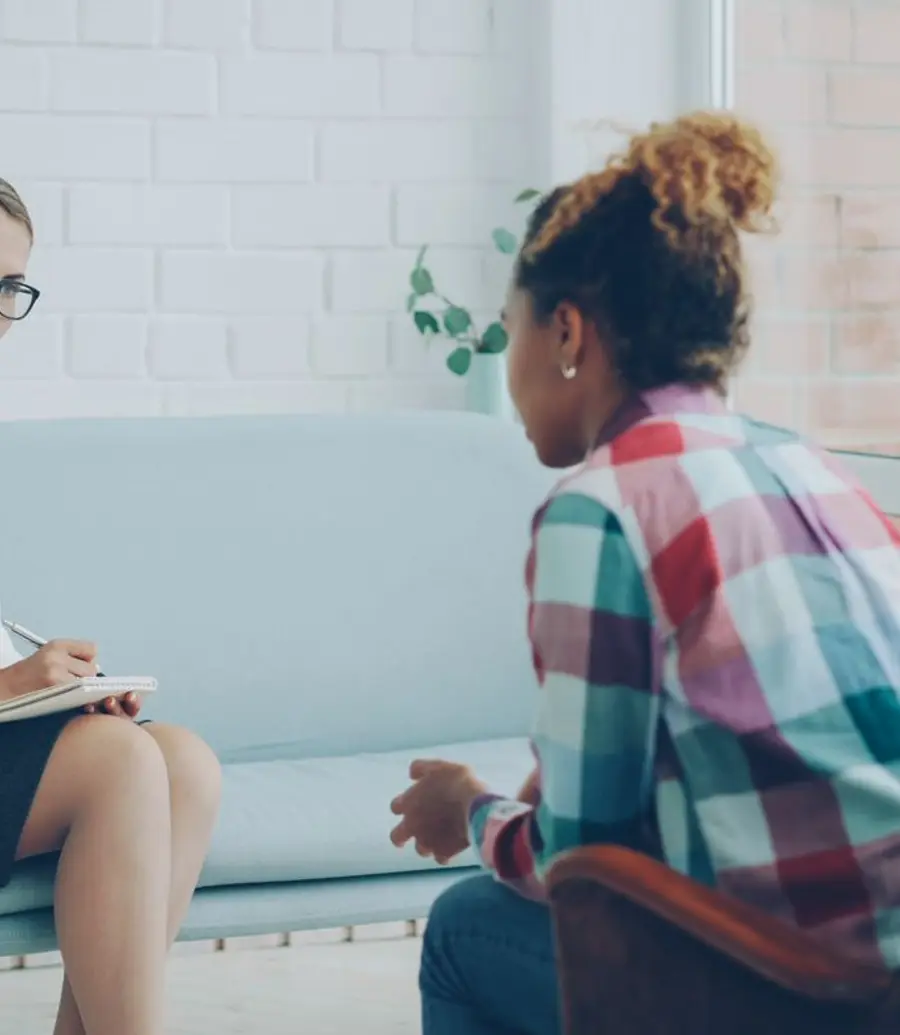 Calm, welcoming private counselling room with two armchairs