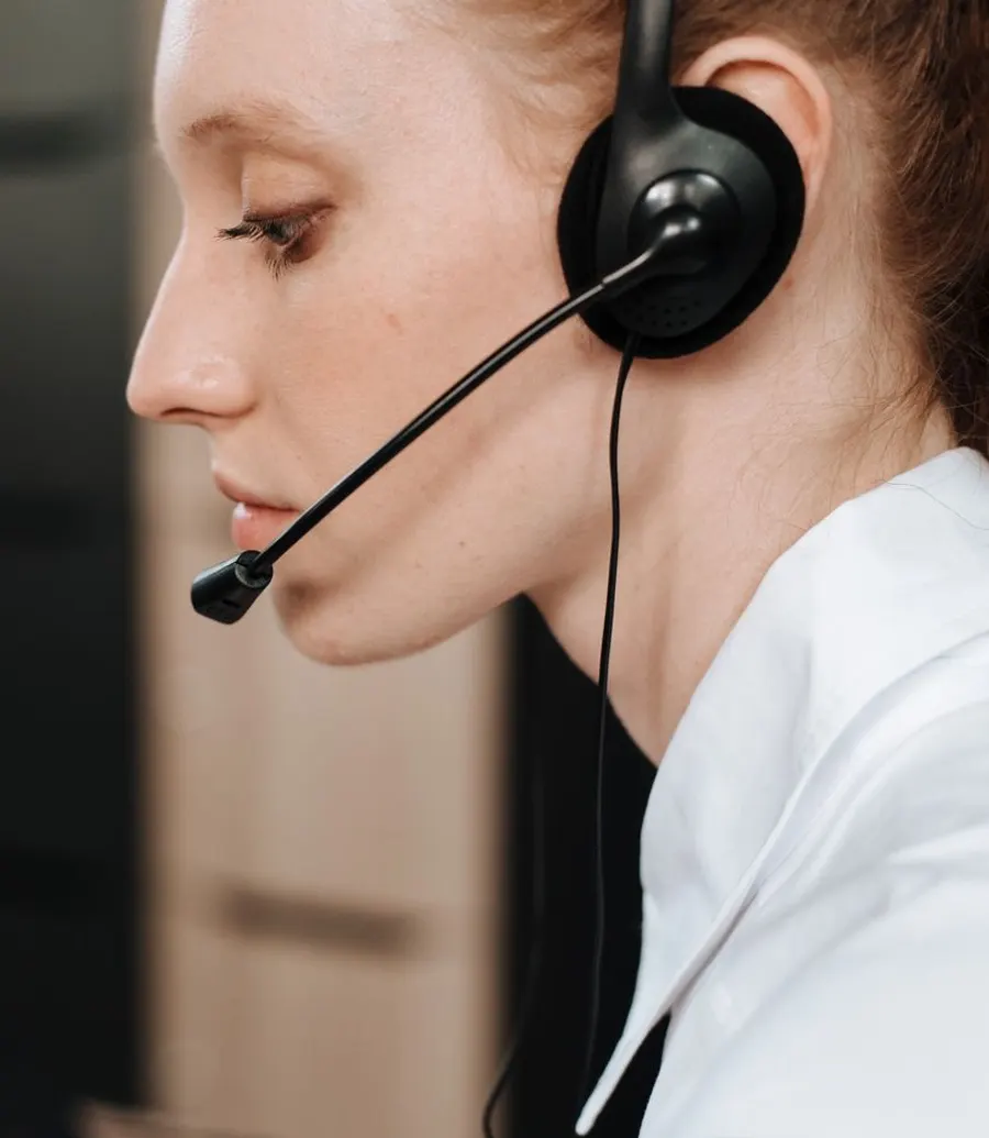 Contact centre agent wearing a headset mid-conversation