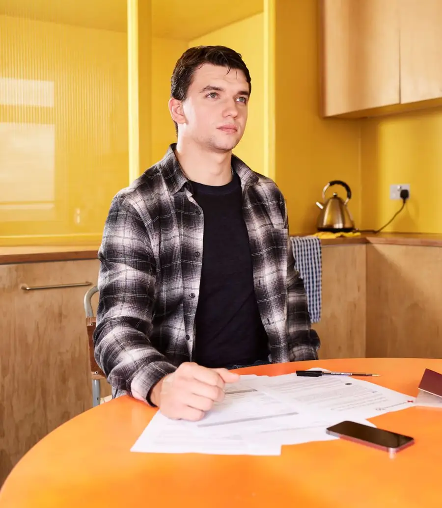 Customer reviewing a utility bill at home with a laptop open